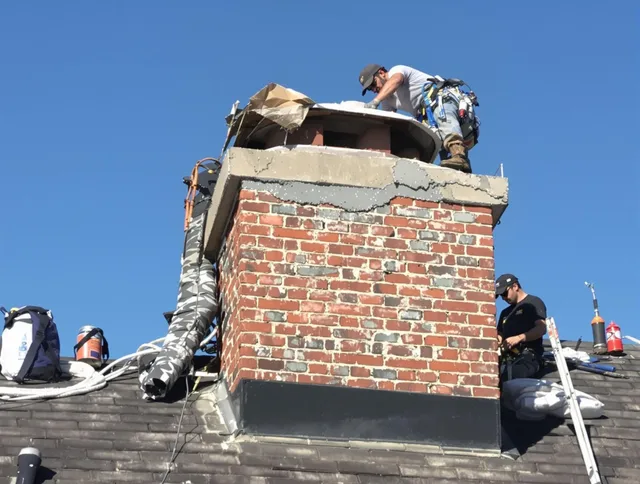 Palm Coast Chimney Sweep installing a custom chimney crown in Palm Coast, FL
