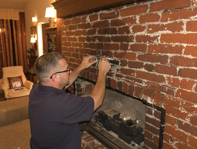 Palm Coast Chimney Sweep expert fixing a fireplace in Palm Coast, FL